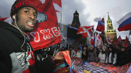 A foreign student holds a symbolic patch-work quilt, symbolizing a friendship during a pro-Kremlin "Nashi" movement's rally in downtown Moscow.