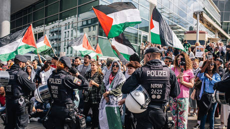 FILE PHOTO: Police stand in front of Pro-Palestine protestors as they chant and wave Palestinian flags to protest the German policies regarding the Israeli attacks on Gaza on June 08, 2024 in Duisburg, Germany.