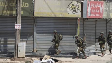 Israeli soldiers patrol during a raid on the Far'a Refugee Camp in the West Bank, August 28, 2024