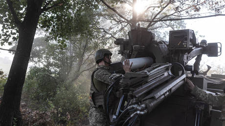 Ukrainian soldiers prepare to fire the French-made Caesar artillery system on the front line in Donbass.