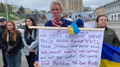 FILE PHOTO. Ryan Wesley Routh holds up a banner during a rally in central Kiev, Ukraine, on April 30, 2022.