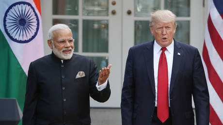 FILE PHOTO: US President Donald Trump and Indian Prime Minister Narendra Modi walk up to deliver joint statements in the Rose Garden of the White House June 26, 2017 in Washington, DC.