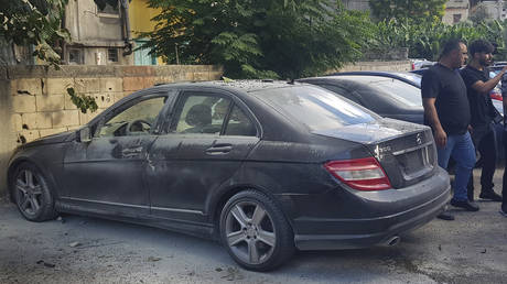 A car damaged after an explosion from what is believed to be a rigged walkie-talkie, Sidon, Lebanon, September 18, 2024.