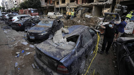 Damaged cars at the site of Friday's Israeli strike on Beirut's southern suburbs, Saturday, September 21, 2024.