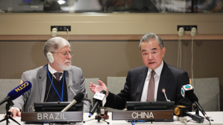 Celso Amorim (L) and Wang Yi co-host a ministerial meeting of the newly launched 'Friends of Peace' platform at the UN General Assembly in New York City, September 27, 2024