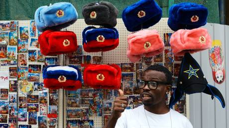 FILE PHOTO: A man near a spot selling souvenirs on Moscow's oldest street, Nikolskaya.