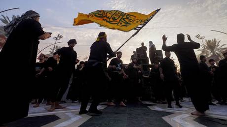 Thousands take part in a mourning event to mark Arbaeen in Iraq's southern city of Karbala on August 24, 2024.