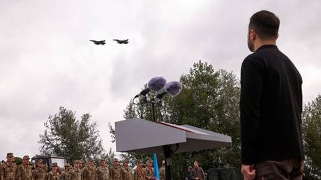 FILE PHOTO: Ukrainian leader Vladimir Zelensky looks at a pair of F-16 fighter jets during a presentation in Kiev in early August 2024.