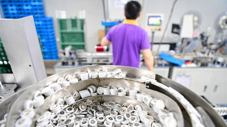 Parts of cylindrical cells are seen on the automated packaging machine at factory producing lithium batteries on June 28, 2024 in Fuzhou, Jiangxi Province of China.