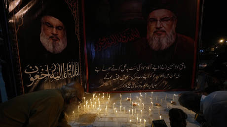 Shiite Muslims light candles during a protest against the killing of Hezbollah leader Hassan Nasrallah, in Karachi, Pakistan, Saturday, Sept. 28, 2024.