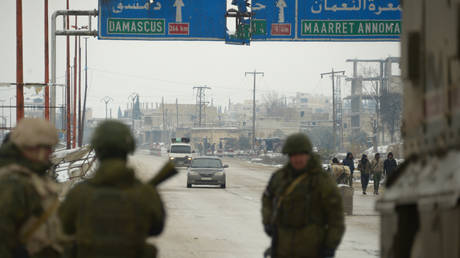 FILE PHOTO. Russian Military Police officers stand on the road in the city of Maarat al-Numan, located on the M5 international highway, 33 km south of Idlib, Syria.