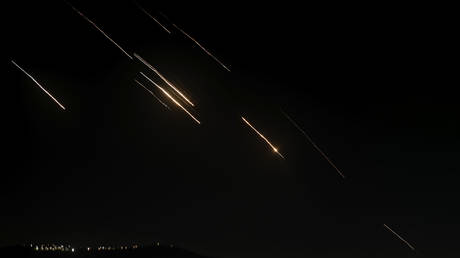 Missiles launched from Iran towards Israel are seen in the West Bank city of Nablus Tuesday, Oct. 1, 2024.