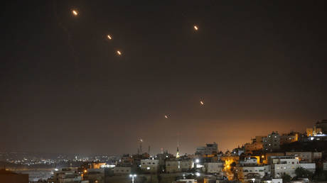 MIssiles fired from Iran fly toward Israeli territory, seen from Hebron in the West Bank, October 1, 2024