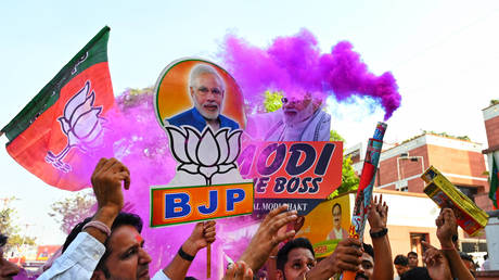 BJP supporters celebrate at party headquarters after Haryana assembly election results were announced on October 8, 2024 in New Delhi, India.