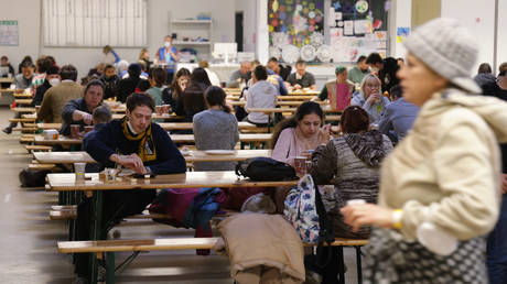 FILE PHOTO: Refugees from Ukraine receive food in a cafeteria at the refugees registration center in Berlin, Germany.