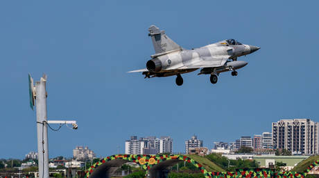 A Taiwanese Air Force Mirage 2000 fighter jet armed lands at the Hsinchu Air Base after a mission.