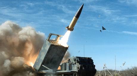 A US M270 MLRS system launches an ATACMS missile.