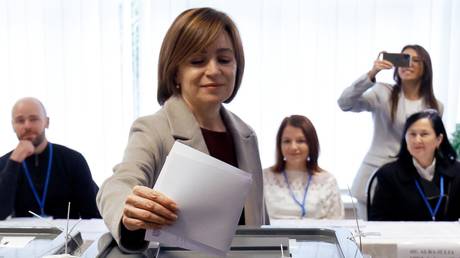 Incumbent Moldovan President Maia Sandu votes at a polling station in the presidential election and the constitutional referendum on EU integration in Chisinau, October 20, 2024.