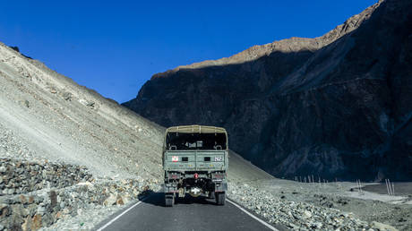 An Indian army vehicle drives on a highway near the Indian Pakistan border on August 31, 2024 , east of Srinagar in Turtuk, Ladakh, India.