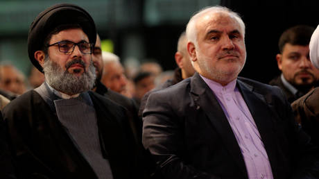 Hezbollah official Hashem Safieddine (L) and Iranian ambassador to Lebanon Mohammad Fathali at a ceremony in Beirut, Lebanon, February 16, 2018.