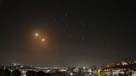 Missiles fired from Iran are seen over Jerusalem from Hebron, West Bank on October 01, 2024.