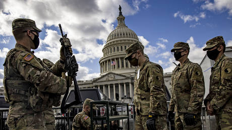 FILE PHOTO: Virginia National Guard soldiers are issued their M4 rifles and live ammunition on the east front of the US Capitol on January 17, 2021 in Washington, DC