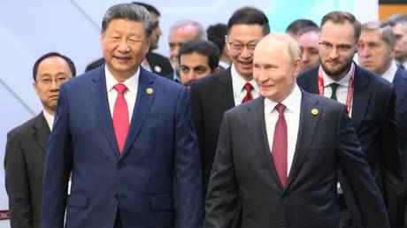 President of Russia Vladimir Putin and President of China Xi Jinping, left, during a limited attendance meeting of BRICS leaders during the 16th BRICS summit in Kazan.