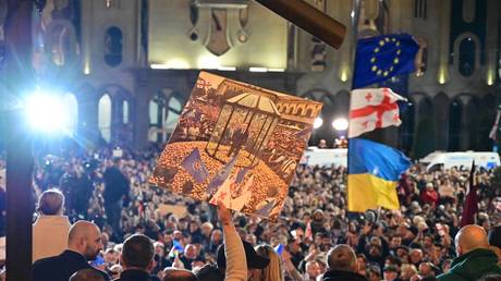 Supporters of Georgia’s pro-Western and pro-EU opposition parties, after losing parliamentary vote, gather outside the parliament in Tbilisi.