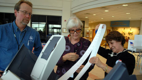 File Photo: A clerk lets election judges check the zero vote count on an electronic voting machine, Broomfield, Colorado, US, October 2006