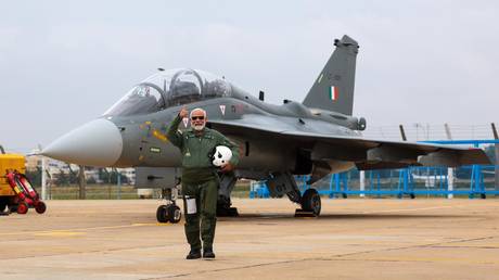 Prime Minister Narendra Modi co-pilots the indigenous light combat aircraft (LCA) Tejas.