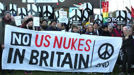 Anti-nuclear protesters gather outside an air force base on November 19, 2022, in Lakenheath, England.