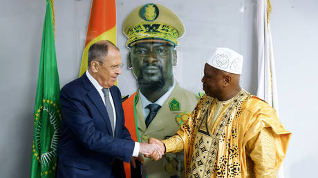 Russian Foreign Minister Sergey Lavrov, left, shakes hands with Guinean Minister of Foreign Affairs, International Cooperation, African Integration and Guineans abroad Morissanda Kouyate during a meeting in Conakry, Guinea.