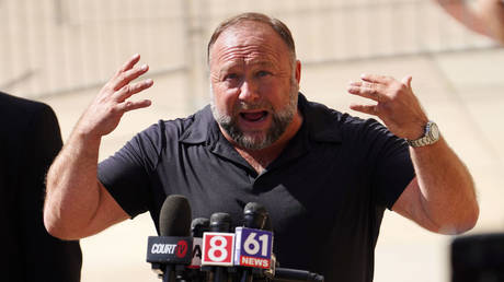 Alex Jones speaks to the media outside his defamation trial in Waterbury, Connecticut, September 21, 2022