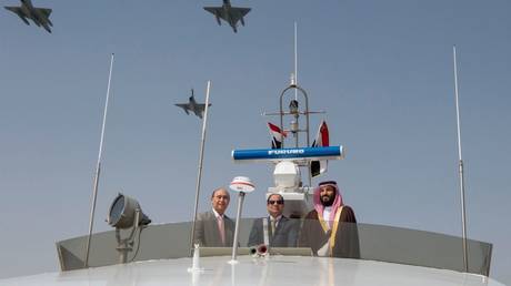 FILE PHOTO. Crown Prince and Defense Minister of Saudi Arabia Mohammad bin Salman al-Saud (R) and Egyptian President Abdel Fattah al-Sisi (C) inspect investment projects in Ismailia, Egypt on March 05, 2018.