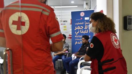 People arrive at the Red Cross building in Beirut to donate blood following a series of pager explosions in Lebanon on September 17, 2024.