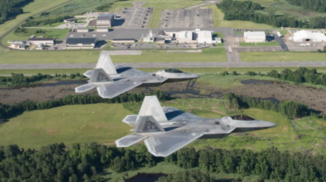 FILE PHOTO: Two US Air Force F-22 Raptors fly over Joint Base Langley-Eustis’ Felker Army Airfield, Virginia, June 14, 2018