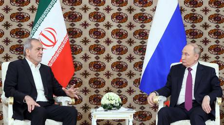 Iranian President Masoud Pezeshkian and Russian President Vladimir Putin attend a meeting in Ashgabat, Turkmenistan.