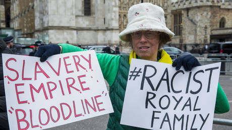 Activists protest during Commonwealth Day service on 13 March 2023 in London, United Kingdom