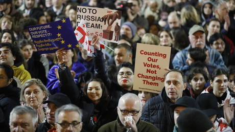 People attend to an opposition rally where Georgia's President Salome Zurabishvili protests results of the parliamentary elections that showed a win for the ruling Georgian Dream party, outside the parliament building in central Tbilisi, Georgia on October 28, 2024.