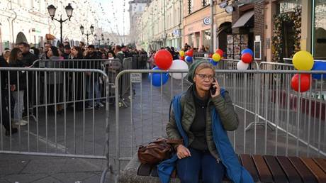 Moldovan citizens queue to vote in the presidential election and the nationwide constitutional referendum on future EU membership in front of the Moldova Embassy in Moscow, Russia