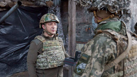 FILE PHOTO: Ukrainian leader Vladimir Zelensky visiting troops in February 2022.