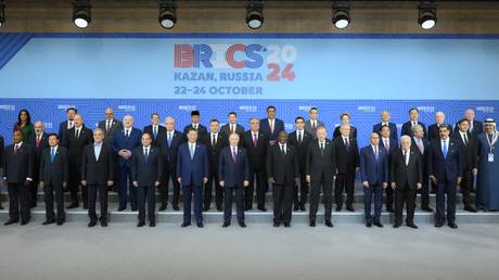 Chinese President Xi Jinping, center left, Russian President Vladimir Putin, and South African President Cyril Ramaphosa, center right, posing for a joint photo of the BRICS leaders during the 16th BRICS summit in Kazan.