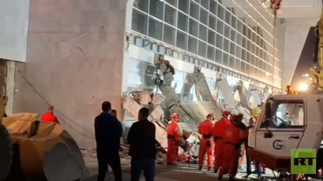 Rescue service workers inspect a scene as a roof collapsed at a railway station in Novi Sad, Serbia.