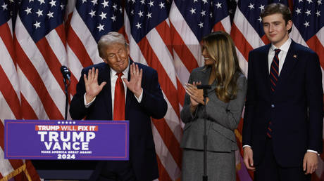 Republican presidential candidate Donald Trump with wife Melania Trump and son Baron Trump during an election night event in West Palm Beach, Florida.