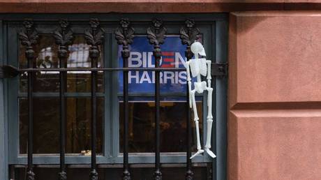 A sign with the names of Joe Biden and Kamala Harris on the window of a house near the Barclays Center in New York