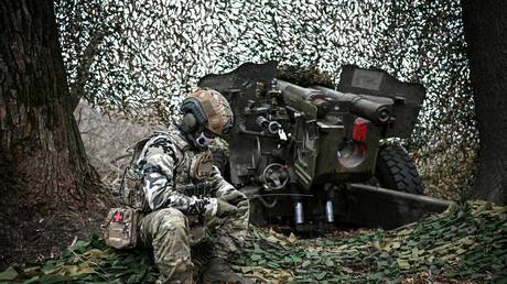 FILE PHOTO: A Russian service member next to a howitzer in Kursk Region, Russia, November 5, 2024.