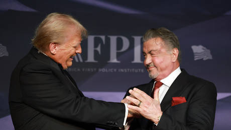 US President-elect Donald Trump greets actor Sylvester Stallone at the America First Policy Institute gala at Mar-a-Lago in Palm Beach, Florida, November 14, 2024.