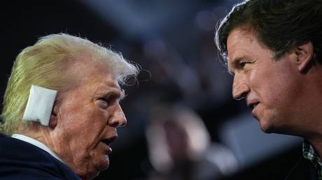 FILE PHOTO: Donald Trump and Tucker Carlson at the 2024 Republican National Convention.