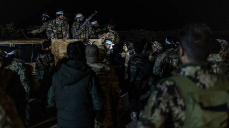 FILE PHOTO: Fighters from the National Liberation Front prepare to join the military action launched by the opposition factions under the name of responding to aggression in Idlib and Aleppo governorates.