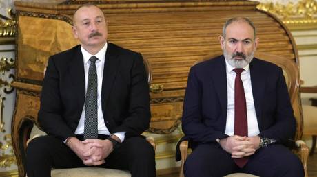 FILE PHOTO: Azerbaijani President Ilham Aliyev and Armenian Prime Minister Nikol Pashinyan.